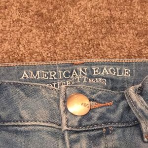 AEO high-rise “destroyed” skinny jeans